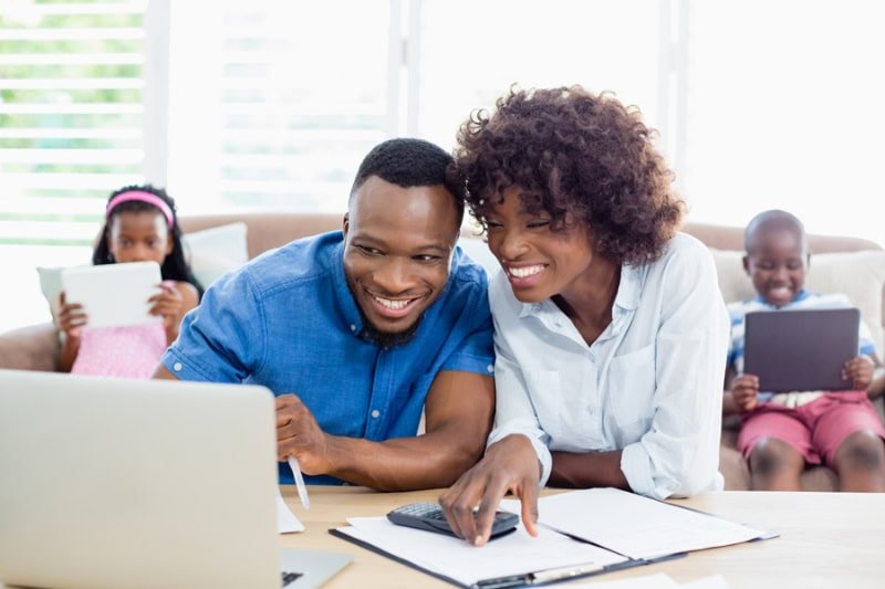 Air Conditioners: Things You May Not Have Known. Couple sitting at table at home